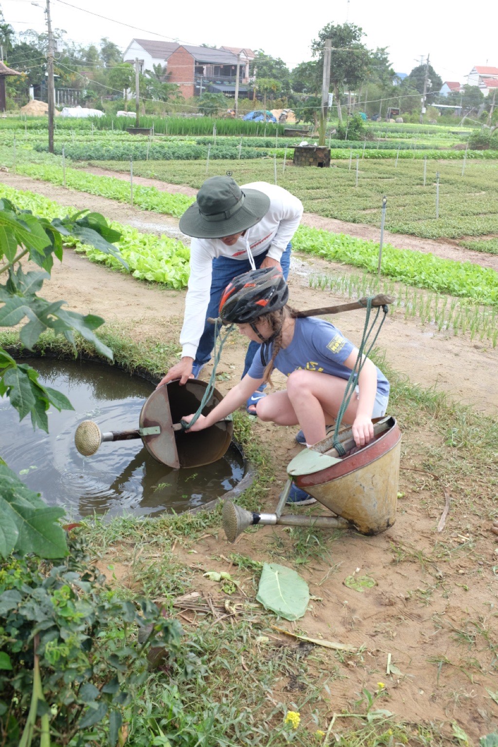 Bella filling watering cans