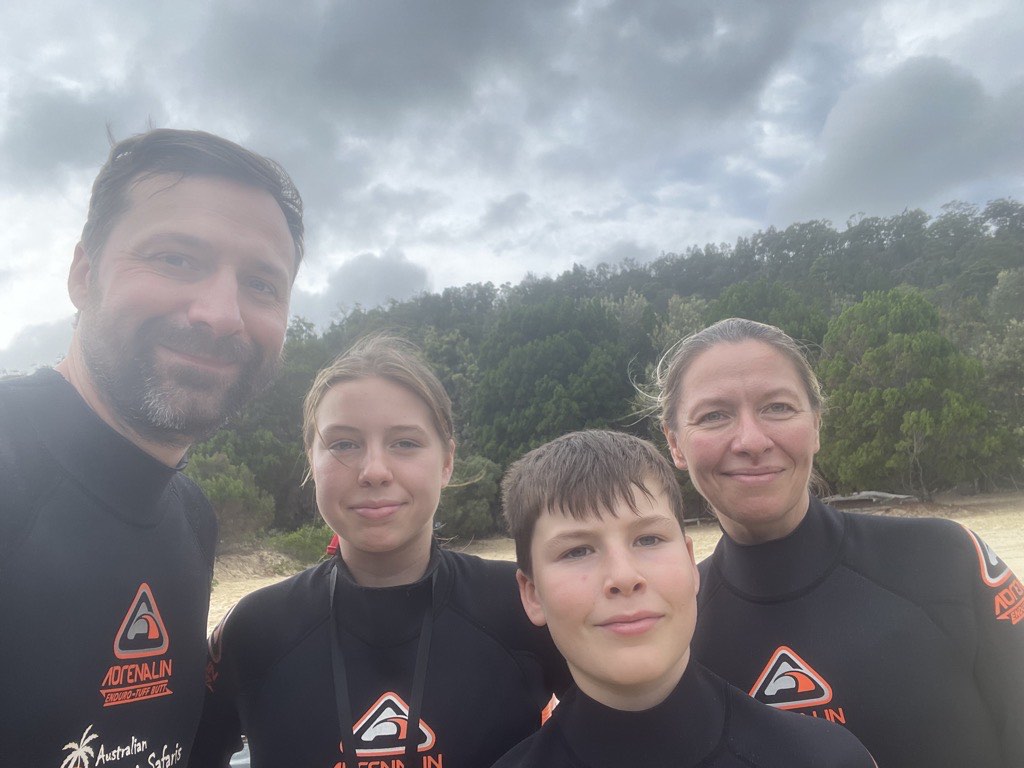 Family in wetsuits