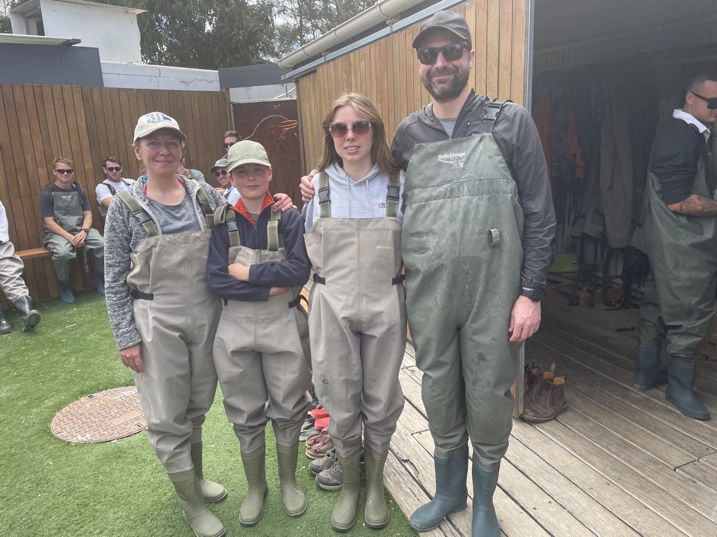 The family wearing waders