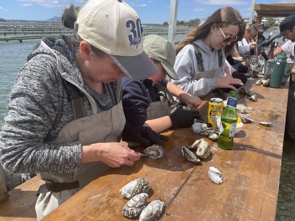 Diana shucking an oyster