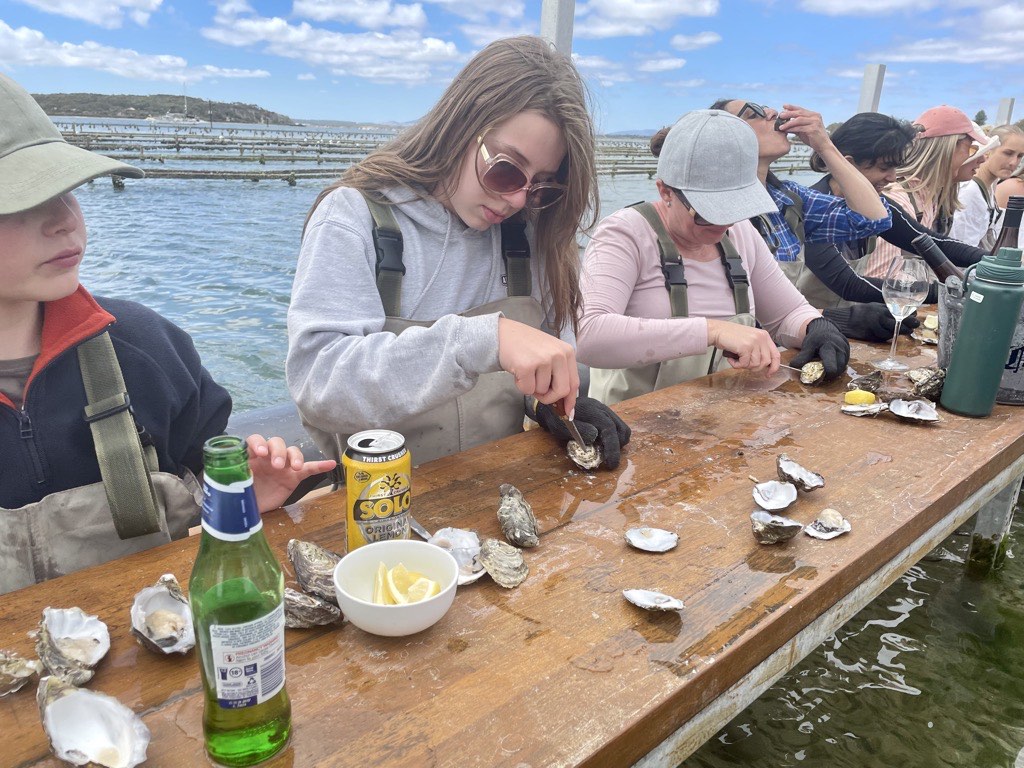 Bella shucking an oyster