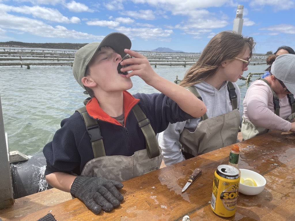 Alex eating an oyster