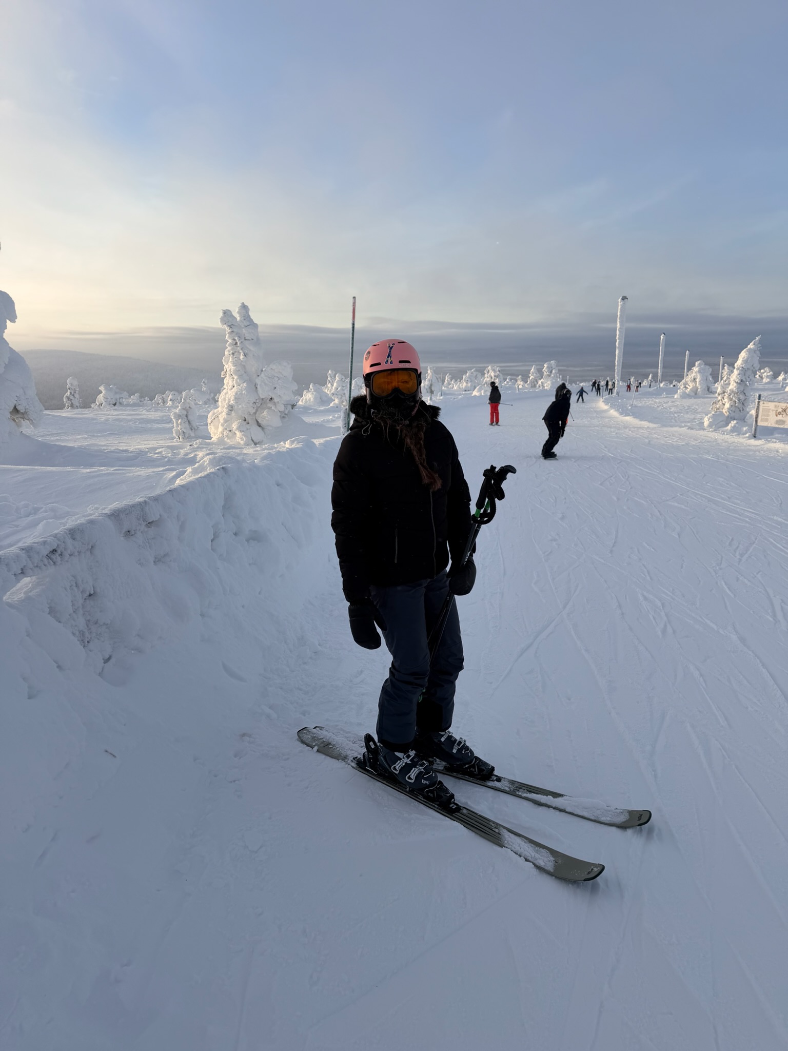 The whole family on the slopes, sun on the horizon behind us
