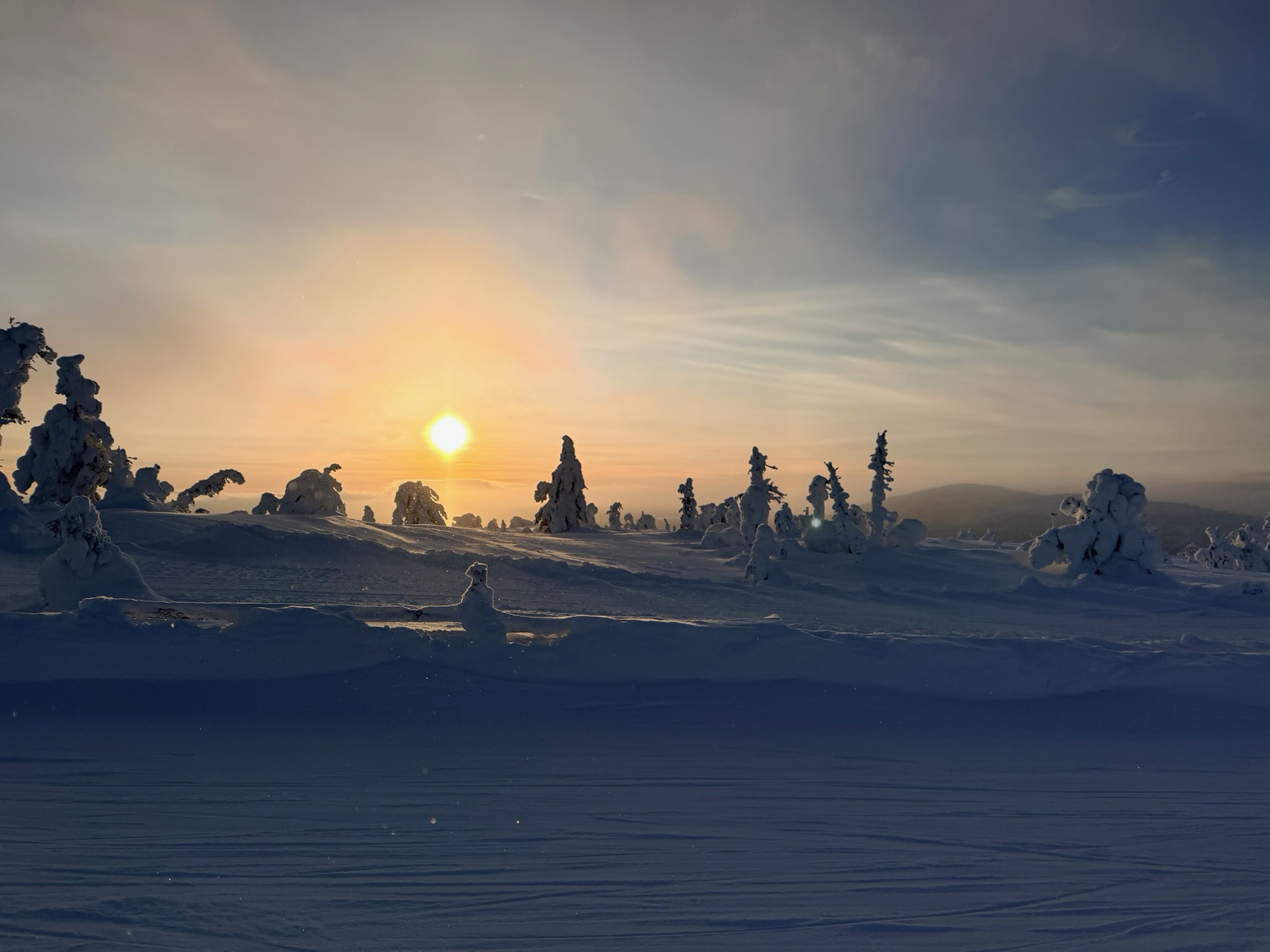 Sunset over the snow-laden fell top — the light was absolutely magical