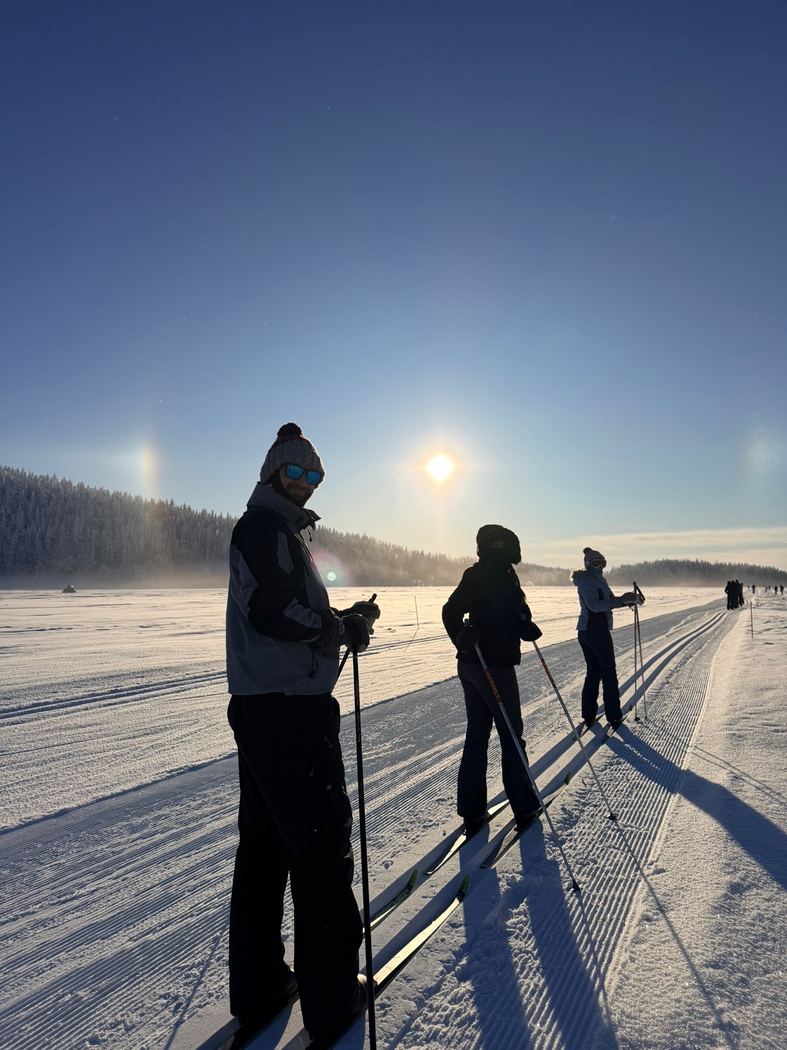 Three of us paused on the trail — sun dogs still going strong