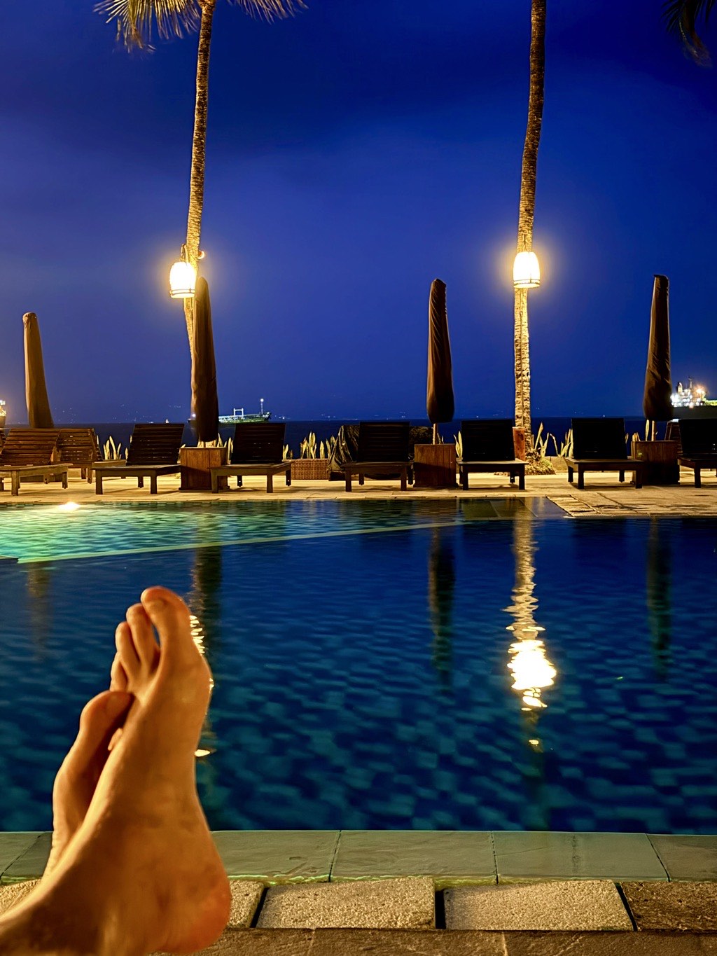 Relaxing by the pool at dusk