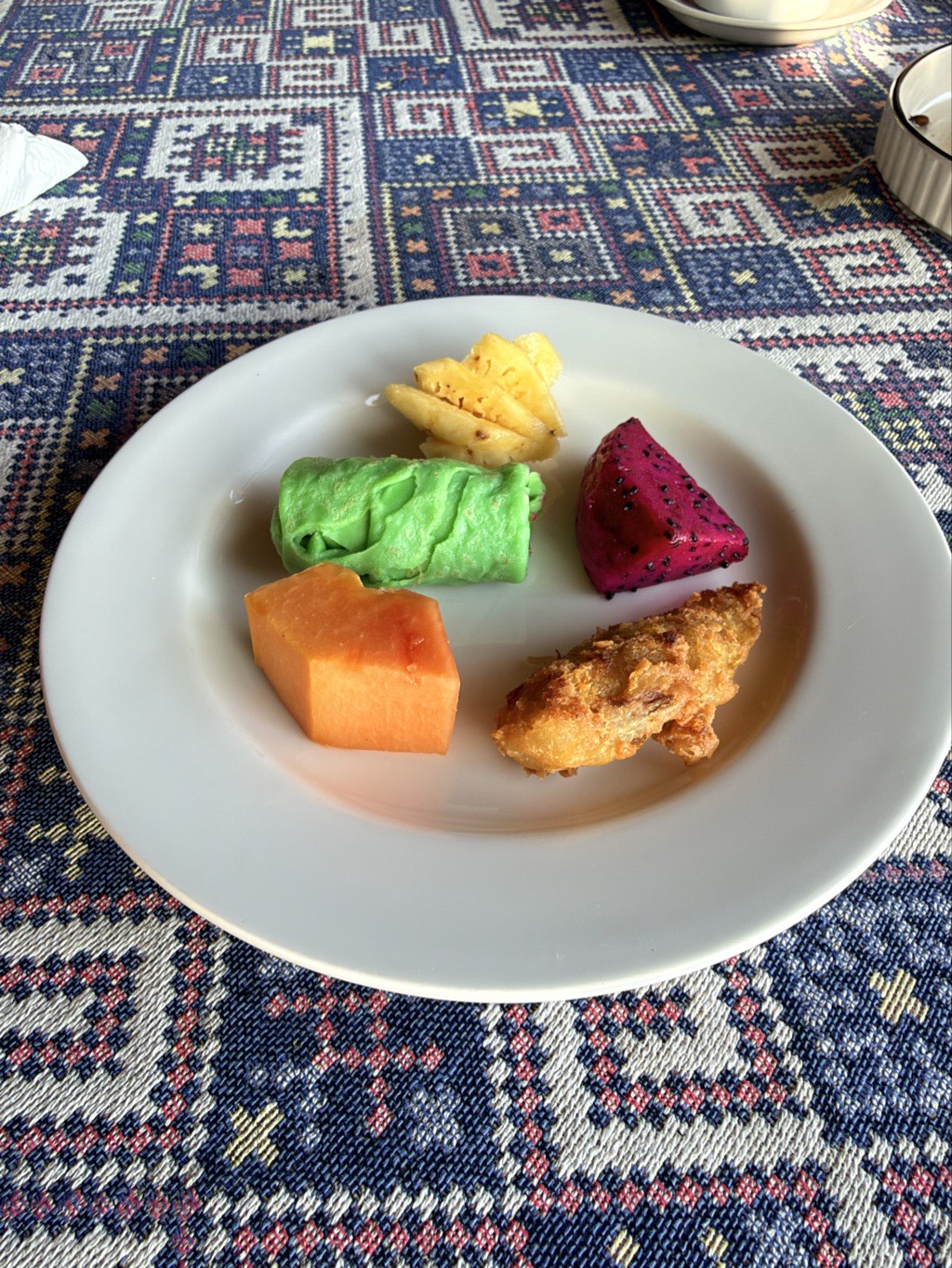 Fruit and fritters at breakfast